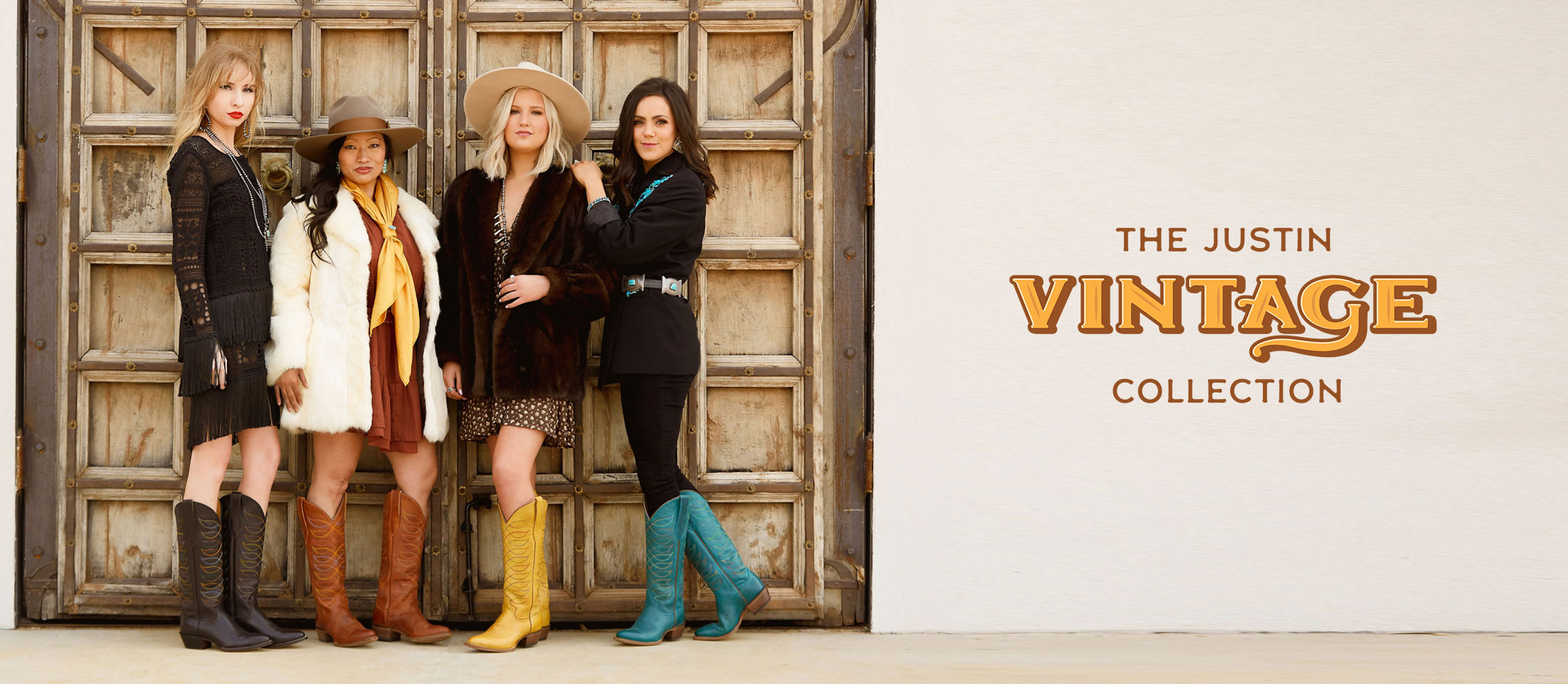 Four women standing in front of a gate wearing Justin Vintage boots. The Justin Vintage Collection.